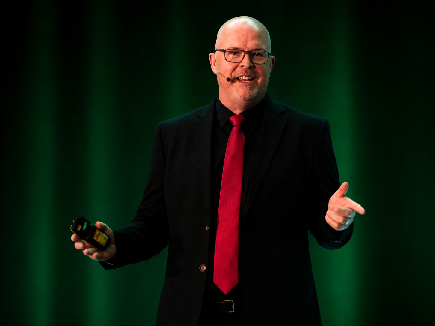 Sean Willard presenting on stage